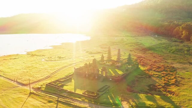 traditional balinese Pura Ulun temple on the morning lake in Bali, Indonesia, Indonesian culture, foggy sunrise on a lake in Bali