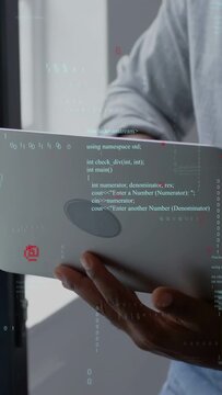 Vertical video: Developer angling laptop, opening and typing while code overlay showing app edits
