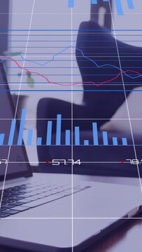 Vertical video: Laptop projecting overlay, bars rising and donut rings updating to display metrics