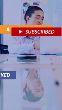 Vertical video: Man using laptop and speaking causing CTAs over glass reflection for ads