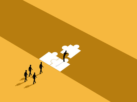 Business leaders put together pieces of a jigsaw puzzle, building bridges for their teams to cross