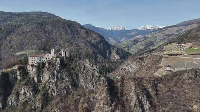 Cinematic Wide Pull-Away Drone Shot of S&auml;ben Abbey and Eisack Valley
