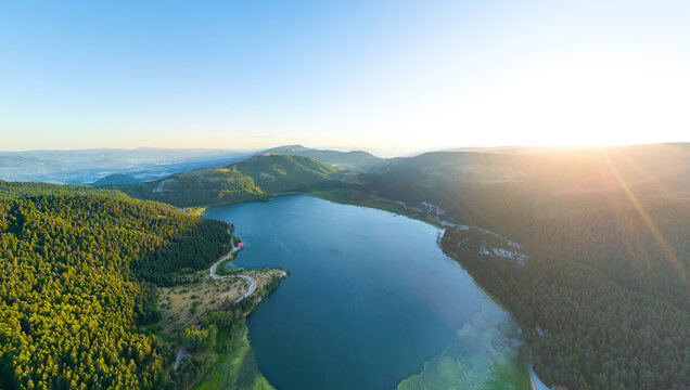 Bolu, Turkey. Abant - Large freshwater lake surrounded by mountains and forest with picturesque views. Sunset time. Summer landscape. Aerial view