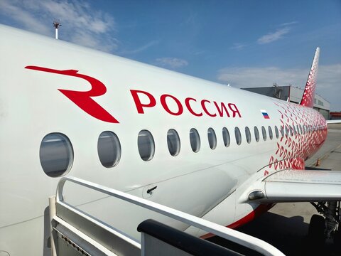 Sukhoi Superjet 100 passenger aircraft of Rossiya Airlines parked at the airport apron on a sunny day. Russia, Moscow, Sheremetyevo Airport, May 6, 2026