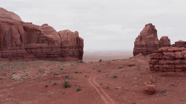 Drone shot of an opening in the Monument Valley.