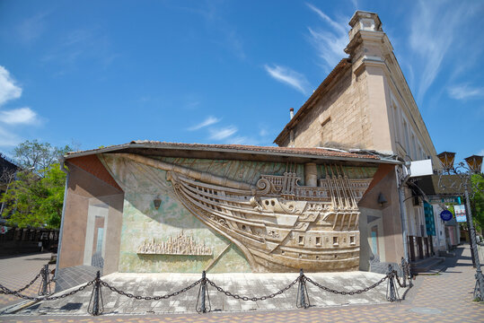 FEODOSIA, CRIMEA - MAY 18, 2024: Panel "Brigantine" on the facade of the museum of the writer Alexander Green. Feodosia, Crimea