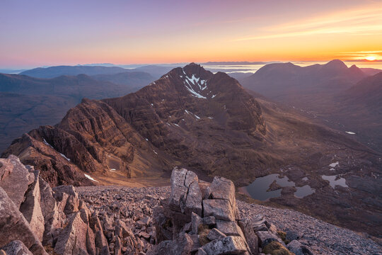 sunset in the mountains of scotland located in Torridon, Scotland.