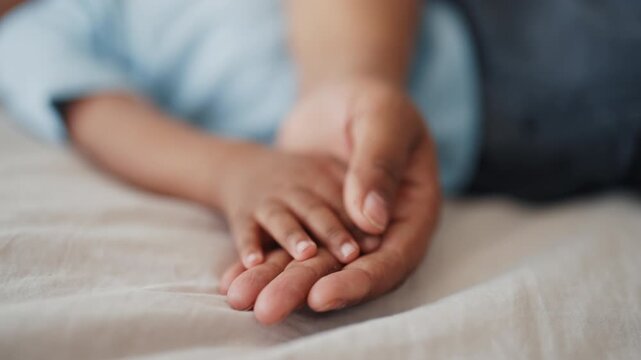 Mother love and care, closeup of hands of woman and infant, african ethnicity. Black lady stroking tiny fingers of her newborn baby, motherhood and parenting, tender moments in happy family at home