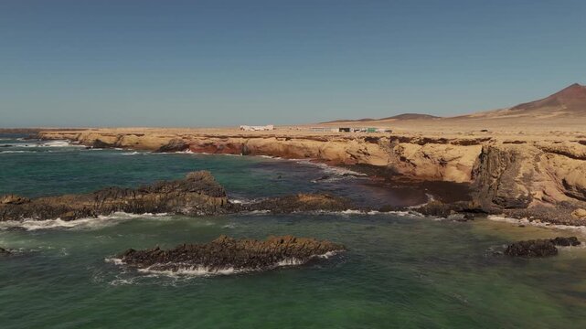 Aerial Drone Orbit of Playa de los Ojos Beach Caves and Volcanic Cliffs, Jandia, Fuerteventura