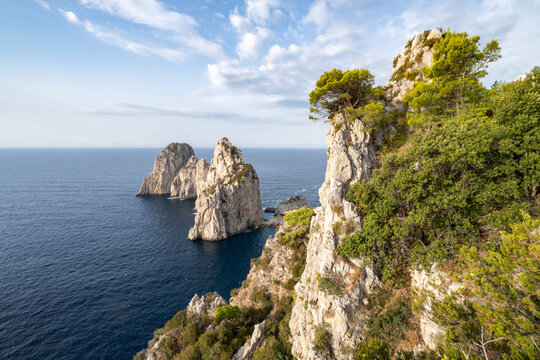 Faraglioni rock formation along the coast of Capri Island, Gulf of Naples, Campania, Italy