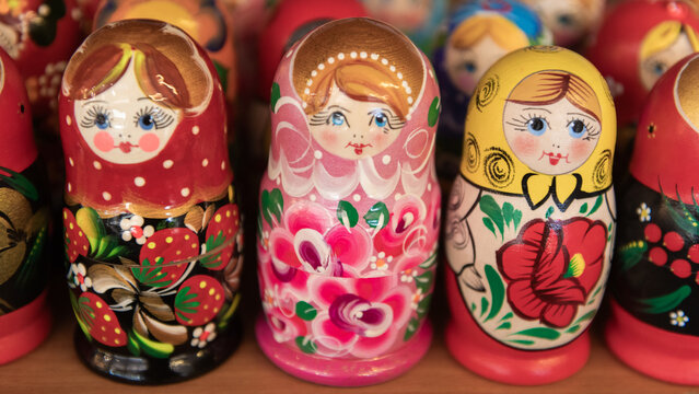 abstract background with colorful wooden matryoshka or russian nesting dolls