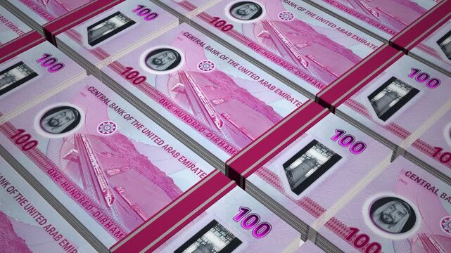 Stacks of new 100 AED or One Hundred United Arab Emirates Dirham Polymer banknotes or currency. Neat Rows of UAE 100 Dirham Bank note in 3D Motion. 4k Animation.