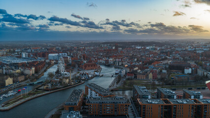 Obraz premium Aerial View of Gdansk Poland with River and Historic Architecture at Dusk