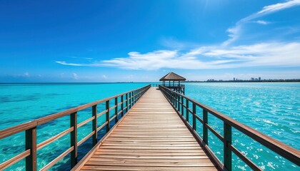 Obraz premium Long wooden pier stretching into turquoise ocean toward tropical hut symbolizing relaxation travel adventure coastal serenity and peaceful exotic vacation destination escape