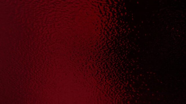 Abstract textured dark red metallic background