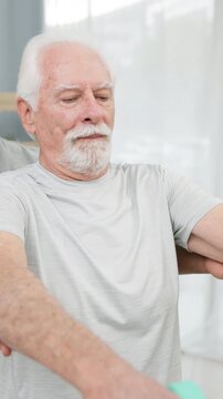 Physiotherapy, dumbbell and person with senior man for mobility, wellness and healing for arthritis. Healthcare, physical therapist and patient with weights for medical service, recovery and exercise