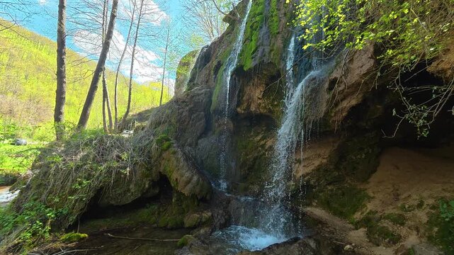 Waterfalls cascade down mossy rock faces. Bigar Waterfall, Stara Planina. (Balkan Mountains), Serbia.