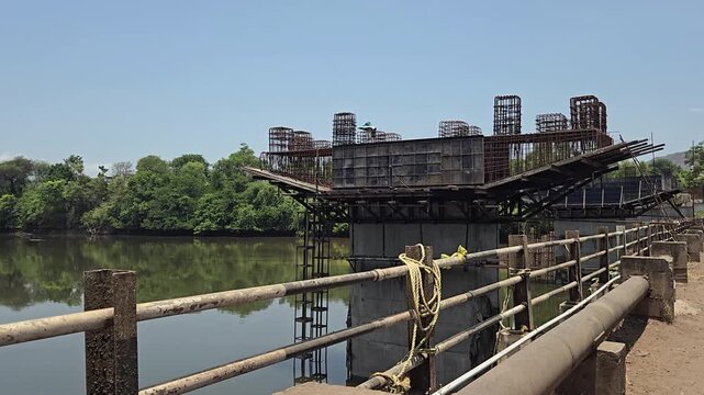 An upgrade adds a high-level rigid bridge next to an old submersible causeway. This elevated layout prevents recurring monsoon flood closures, delivering safe, uninterrupted, year-round river crossing