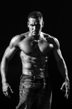 Strong man with torso. Sexy muscular man. Sensual mans body. Fitness model. Black and white