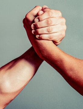 Arm wrestling. Two hands. Muscular men measuring forces, arms. Hand wrestling compete