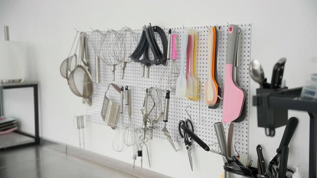 Bakery tools and pastry utensils on wall