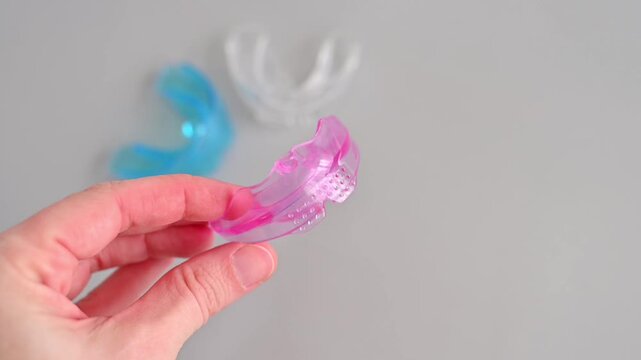 Silicone dental mouth guard trainer for children to correct bite and teeth alignment on a white background
