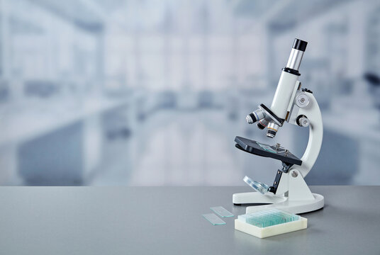 Laboratory microscope with microscope slides and copy space