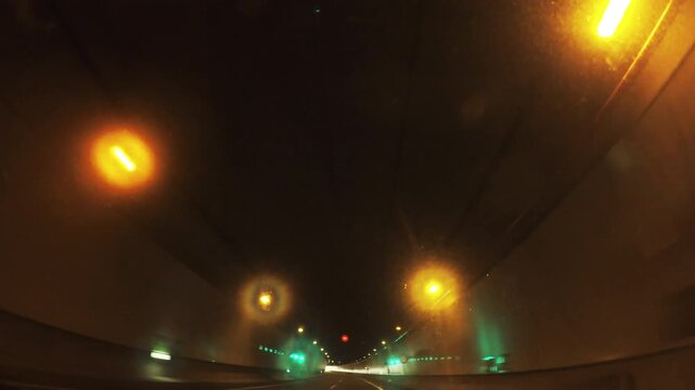 Driving in a dimly lit urban tunnel