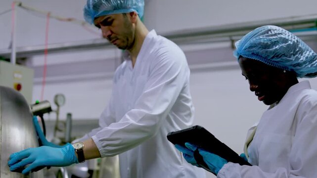 Industrial process observation manufacturing facility training session controlled environment close-up team collaboration