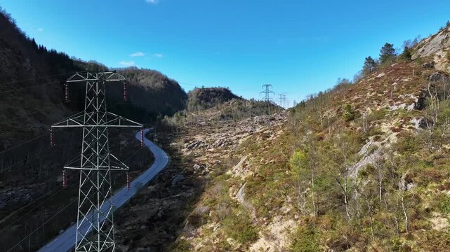 High voltage power lines through Bruvikdalen Osteroy Norway showing energy infrastructure