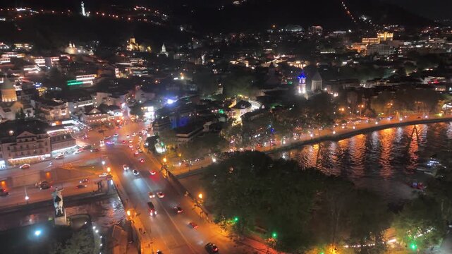 Aerial Flight Night Establishing Metekhi Bridge Traffic and Old Town Tbilisi Georgia