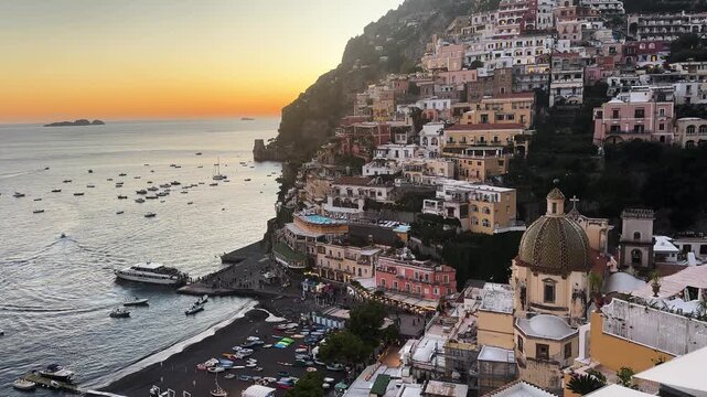 Thyrenian Sea and row of bright umbrellas on beach of Positano - famous old italian resort, Italy