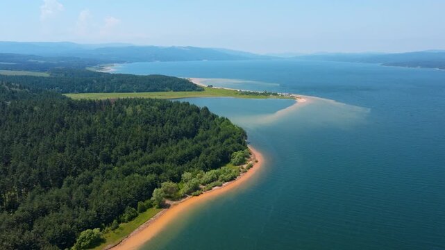 Shiroka Polyana Iskar Reservoir Sandy Beach Curved Shoreline Aerial Drone View Bulgaria Pine Forest Turquoise Water Mountain Background Summer Blue Sky Tourism Travel Nature Scenic Landscape Tranquil 
