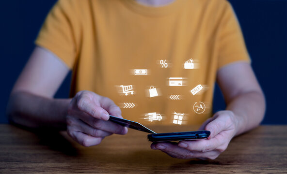 Person using smartphone with futuristic AI hologram icons, representing online shopping, e-commerce, mobile payment, digital marketplace, smart technology, and modern online business communication.