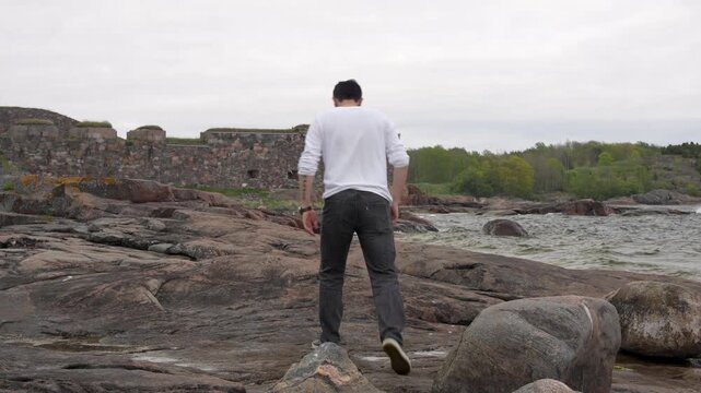 man walking on the beach