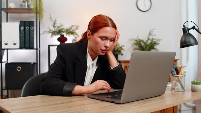 Young businesswoman at home office types report on laptop fighting fatigue as night drags. Freelancer girl at table finally dozes off face on keyboard overwhelmed by workload missing deadline in rush