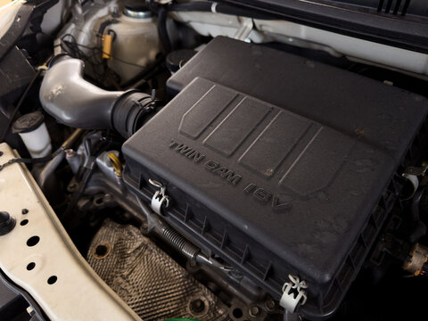 PENANG, MALAYSIA - DEC 08, 2025: Close up of a car engine bay with Twin Cam 16V air filter box inside a compact vehicle.