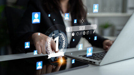 Naklejka premium Business professional analyzing SEO strategy with digital icons representing online presence and user engagement in a modern office setting Quark.