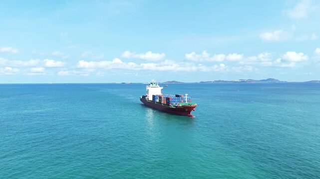 cargo container ship fully loaded with pink and red containers, assisted by a tugboat in the turquoise ocean. Global maritime logistics and supply chain concept.	international trade, and heavy ship