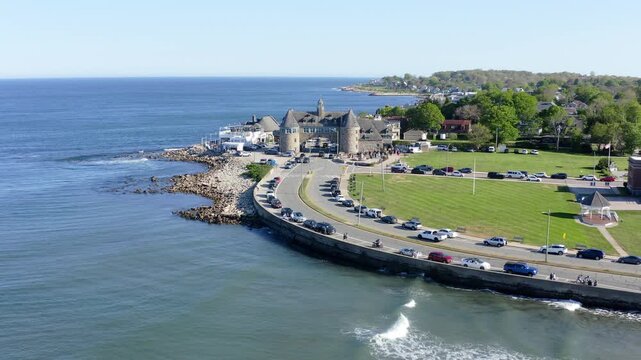 Aerial view of cars driving near the towers in narragansett rhode island on a beauitful summer day, pullback wide shot.