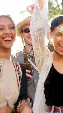 Excited, friends and dancing with hug at festival for fun, celebration and energy at live concert. Smile, people and embrace for social gathering, freedom and moving with rhythm at outdoor rave party