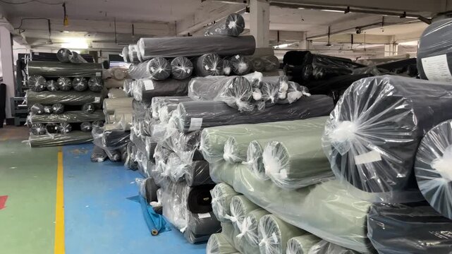 Fabric rolls stored in Textile warehouse factory 