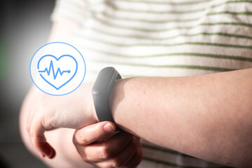 Fototapeta premium Health tracker on woman hand. Focus on calm health tracking. Balance between digital anxiety and calm life living. Data as background whisper