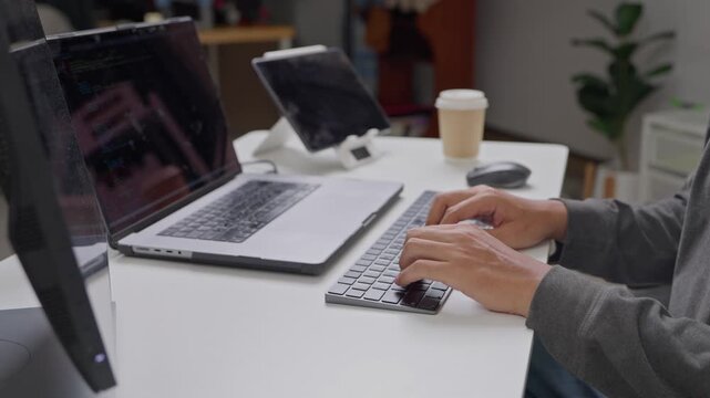 Office workspace productivity hands typing on laptops modern office digital interaction collaborative environment close-up work efficiency