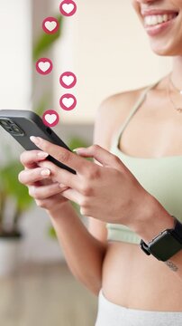 Social media, hands and woman with phone emoji for love, online dating and overlay at fitness gym. Happy person, mobile and typing with heart symbol, icon and romantic update with notification on app