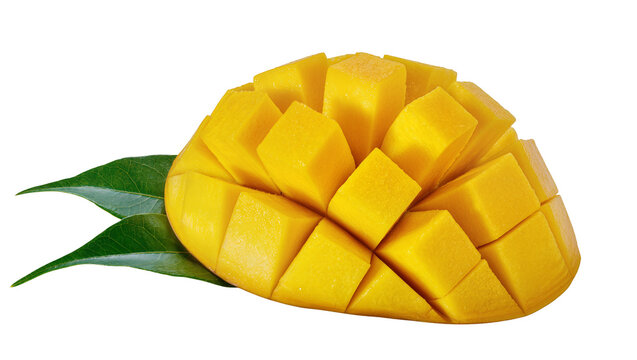 Fresh ripe mango cut into cubes with green leaves