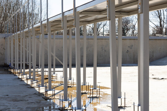Metal framework supports installed on concrete foundation at construction site