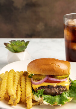 cheese burge  with a side of french fries