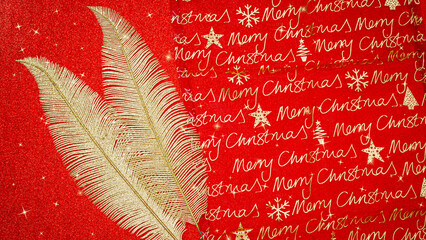 Bright red Christmas wrapping paper with golden leaves and repeated greetings © Fleuronica