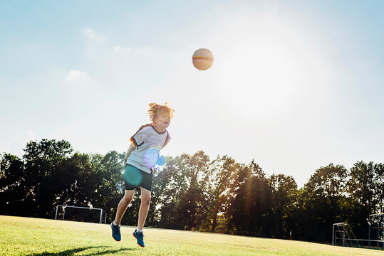 Boy wearing German football shirt playing soccer